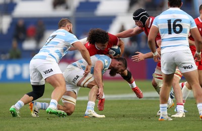 110726 - Argentina v Wales - Nations Championship - Kane James of Wales is tackled by Marcos Kremer of Argentina 
