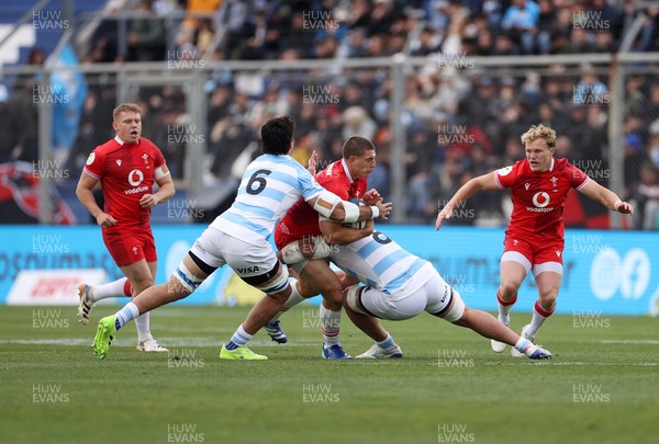 110726 - Argentina v Wales - Nations Championship - Joe Hawkins of Wales is tackled by Santiago Grondona and Joaquin Oviedo of Argentina 