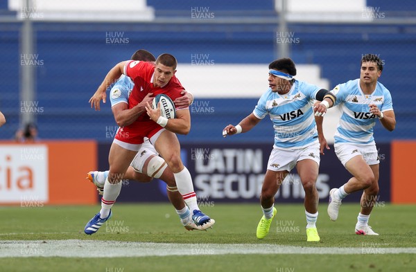 110726 - Argentina v Wales - Nations Championship - Joe Hawkins of Wales is tackled by Guido Petti of Argentina 