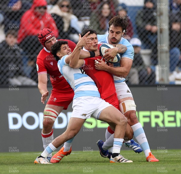 110726 - Argentina v Wales - Nations Championship - Louis Rees-Zammit of Wales is tackled by Simon Benitez Cruz of Argentina 