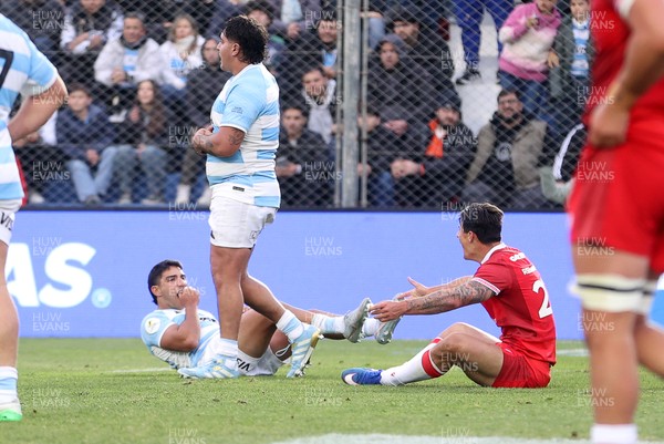 110726 - Argentina v Wales - Nations Championship - Louis Rees-Zammit of Wales is taken out by Santiago Carreras of Argentina 