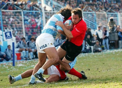 12-06-04. Argentina v Wales (1st Test in Tucuman).  Wales' Rhys Williams is held up by Jose Piossek as he gets close to line.  