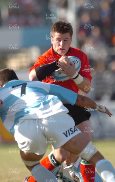 12-06-04. Argentina v Wales (1st Test in Tucuman).  Wales' Ceri Sweeney is caught by Lucas Ostiglia.  