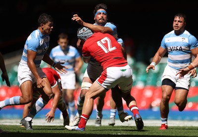 170721 - Wales v Argentina - Summer International Series - Rodrigo Bruni of Argentina is tackled by Jonathan Davies of Wales