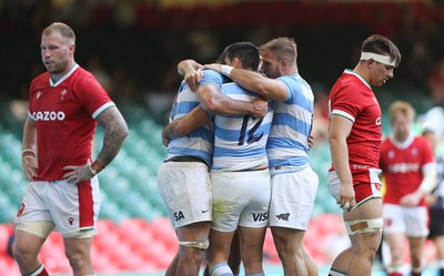 170721 - Argentina v Wales, Summer International Series, Second Test - Pablo Matera of Argentina celebrates with team mates after scoring try as Ross Moriarty of Wales  and Taine Basham of Wales show the disappointment