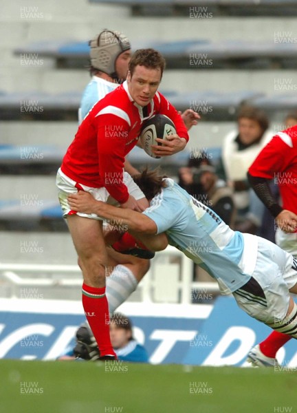 17.06.06. ARGENTINA V WALES,Velez Sarsfield, Buenos Aires  Mark Jones is tackled by Francisco Leonelli.  