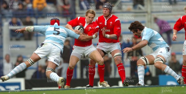 17.06.06. ARGENTINA V WALES,Velez Sarsfield, Buenos Aires  Matthew Watkins is stopped by Rimas Alvarez Kairelis  