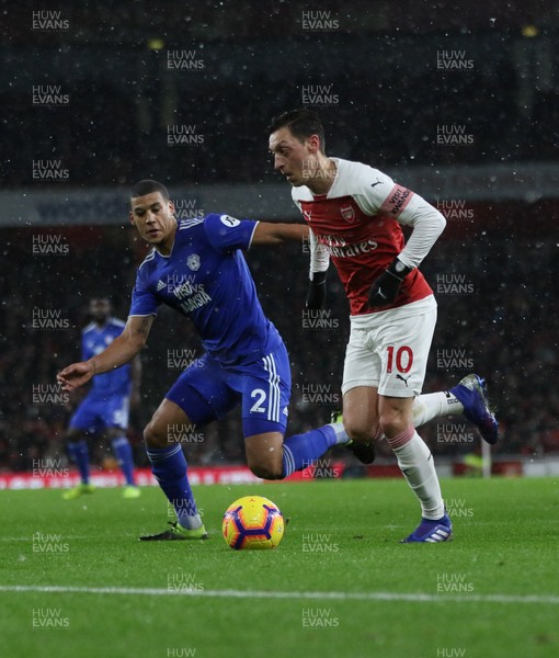 290119 -  Arsenal v Cardiff City, Premier League - Lee Peltier of Cardiff City and Mesut Ozil of Arsenal compete for the ball