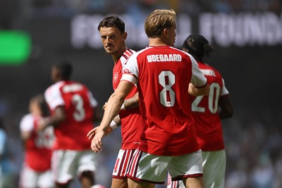 160826 - Arsenal v Manchester City - FA Community Shield - Ben White of Arsenal celebrates with team mates after Riccardo Calafiori of Arsenal scores a goal