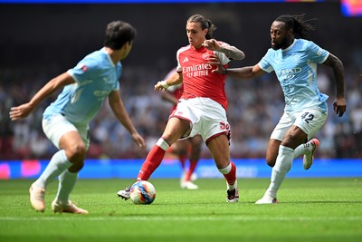 160826 - Arsenal v Manchester City - FA Community Shield - Riccardo Calafiori of Arsenal is challenged by Antoine Semenyo of Manchester City