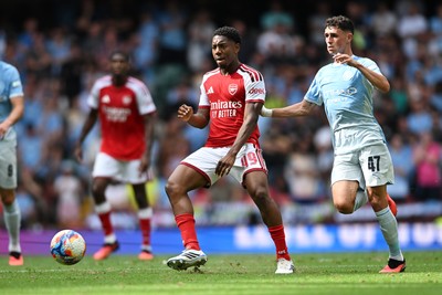 160826 - Arsenal v Manchester City - FA Community Shield - Myles Lewis-Skelly of Arsenal is challenged by Phil Foden of Manchester City