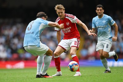 160826 - Arsenal v Manchester City - FA Community Shield - Martin Odegaard of Arsenal is challenged by Ruben Dias of Manchester City