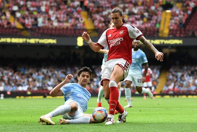 160826 - Arsenal v Manchester City - FA Community Shield - Riccardo Calafiori of Arsenal is tackled by Abdukodir Khusanov of Manchester City