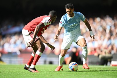 160826 - Arsenal v Manchester City - FA Community Shield - Omar Marmoush of Manchester City is challenged by Gabriel of Arsenal