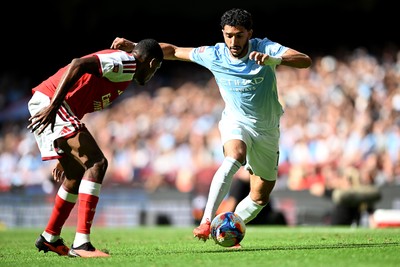 160826 - Arsenal v Manchester City - FA Community Shield - Omar Marmoush of Manchester City is challenged by Gabriel of Arsenal