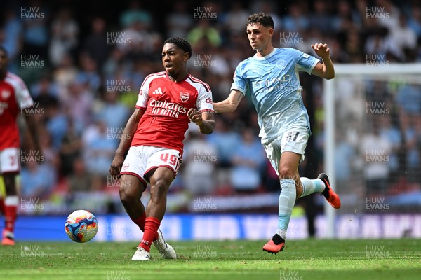 160826 - Arsenal v Manchester City - FA Community Shield - Myles Lewis-Skelly of Arsenal is challenged by Phil Foden of Manchester City