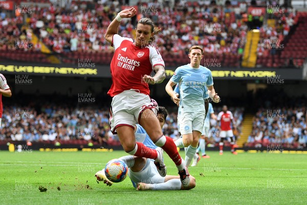 160826 - Arsenal v Manchester City - FA Community Shield - Riccardo Calafiori of Arsenal is tackled by Abdukodir Khusanov of Manchester City