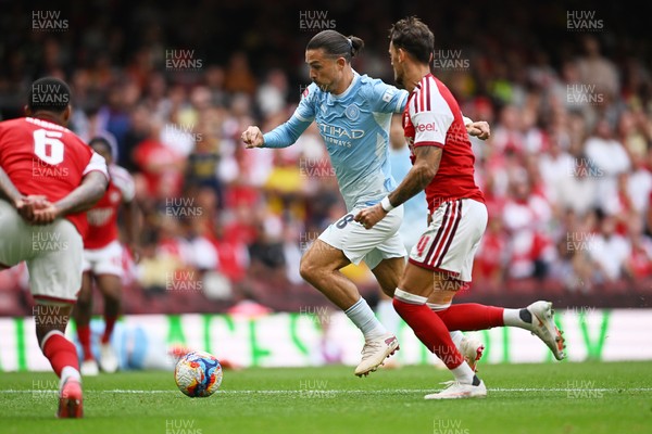 160826 - Arsenal v Manchester City - FA Community Shield - Jack Grealish of Manchester City is challenged by Martin Odegaard of Arsenal