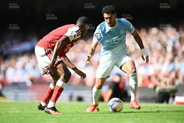 160826 - Arsenal v Manchester City - FA Community Shield - Omar Marmoush of Manchester City is challenged by Gabriel of Arsenal
