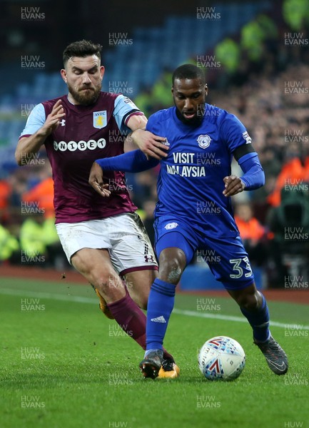 100418 - Aston Villa v Cardiff City - SkyBet Championship - Junior Hoilett of Cardiff City is tackled by Robert Snodgrass of Aston Villa who receives a yellow card