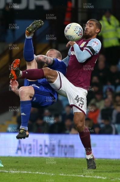 100418 - Aston Villa v Cardiff City - SkyBet Championship - Aron Gunnarsson of Cardiff City has his overhead kick blocked by Lewis Grabban of Aston Villa