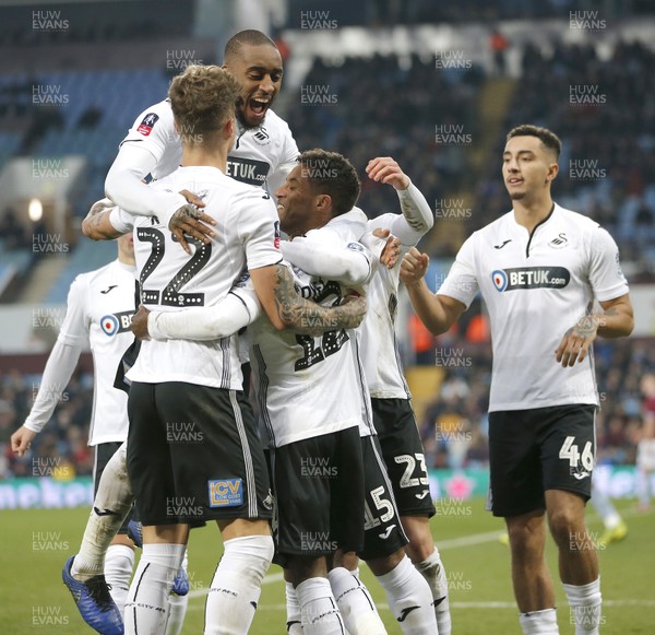 050119 - Aston Villa v Swansea City - FA Cup Third Round - Nathan Dyer of Swansea celebrates scoring a goal with team with Leroy Fer on top  