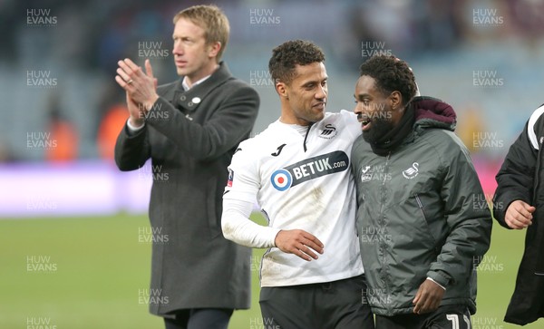 050119 - Aston Villa v Swansea City - FA Cup Third Round - Wayne Routledge and Nathan Dyer of Swansea at the end of the match salute the travelling fans with Manager Graham Potter 