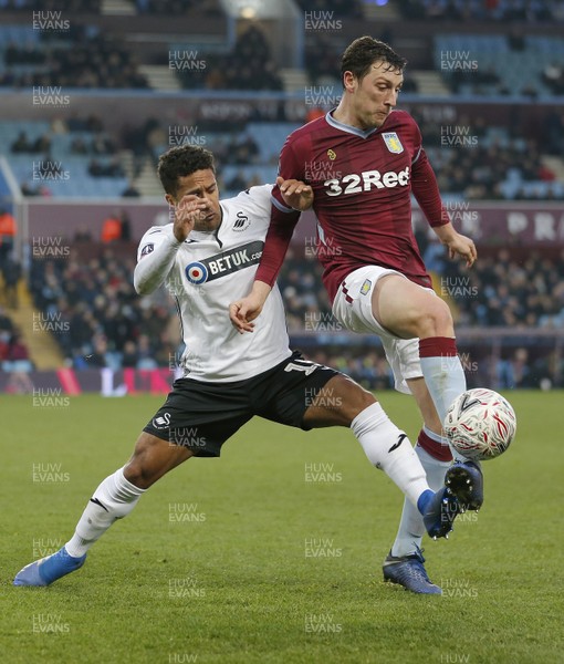 050119 - Aston Villa v Swansea City - FA Cup Third Round - Wayne Routledge of Swansea and Tommy Elphick of Aston Villa  