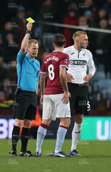 050119 - Aston Villa v Swansea City - FA Cup Third Round - Henri Lansbury of Aston Villa gets a yellow card from Referee Gavin Ward  