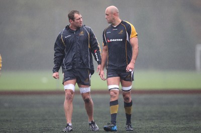 04.11.10..Australia Rugby Training session, University Playing Field, Treforest-  Australia's captain Rocky Elsom (left) and Nathan Sharpe during a wet training session at Treforest near Cardiff 