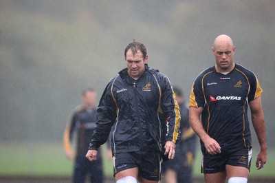 04.11.10..Australia Rugby Training session, University Playing Field, Treforest-  Australia's captain Rocky Elsom (left) and Nathan Sharpe during a wet training session at Treforest near Cardiff 