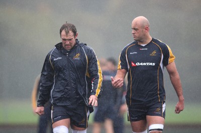 04.11.10..Australia Rugby Training session, University Playing Field, Treforest-  Australia's captain Rocky Elsom (left) and Nathan Sharpe during a wet training session at Treforest near Cardiff 