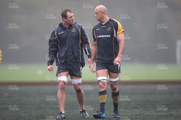 04.11.10..Australia Rugby Training session, University Playing Field, Treforest-  Australia's captain Rocky Elsom (left) and Nathan Sharpe during a wet training session at Treforest near Cardiff 