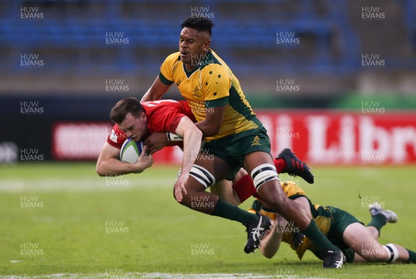 300518 - Australia U20 v Wales U20, World Rugby U20 Championship 2018 Pool A, France - Cai Evans of Wales is tackled by  Isaac Lucas of Australia and Esei Haangana of Australia