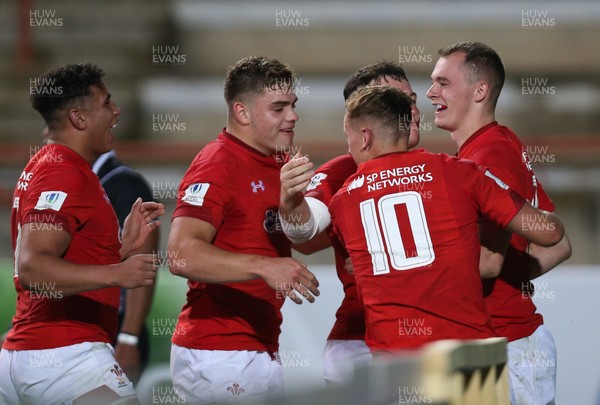 300518 - Australia U20 v Wales U20, World Rugby U20 Championship 2018 Pool A, France - Players celebrate with Ioan Nicolas of Wales after he scores try