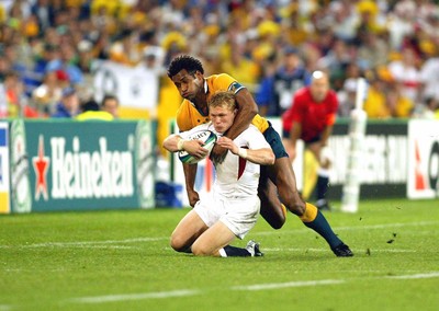 221103 - Australia v England - Rugby World Cup Final - England's Josh Lewsey is tackled by Lote Tuqiri