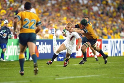 221103 - Australia v England - Rugby World Cup Final - England's Iain Balshaw is tackled by Justin Harrinson