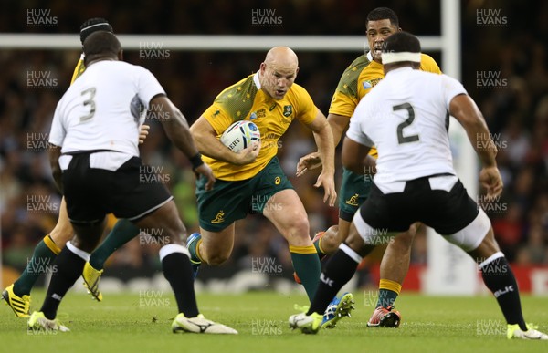 230915 - Australia v Fiji, Rugby World Cup 2015 - Stephen Moore of Australia takes on Manasa Saulo of Fiji and Talemaitoga Tuapati of Fiji