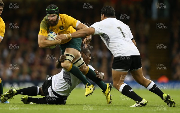 230915 - Australia v Fiji, Rugby World Cup 2015 - Scott Fardy of Australia is tackled by Manasa Saulo of Fiji and Campese Ma’afu of Fiji