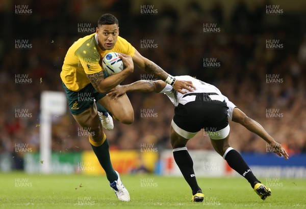 230915 - Australia v Fiji, Rugby World Cup 2015 - Israel Folau of Australia takes on Metuisela Talebula of Fiji