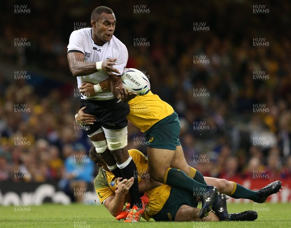 230915 - Australia v Fiji, Rugby World Cup 2015 - Leone Nakarawa of Fiji is tackled by Greg Holmes of Australia and Tatafu Polota-Nau of Australia