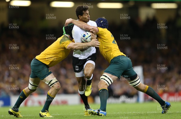 230915 - Australia v Fiji, Rugby World Cup 2015 - Ben Volavola of Fiji is tackled by Scott Fardy of Australia and Bernard Foley of Australia