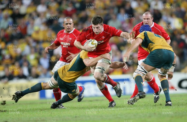 02.06.07 AUSTRALIA v WALES, 2nd Test ,Brisbane. Wales Michael Owen goes through Dan Vickerman and Rocky Elsom 