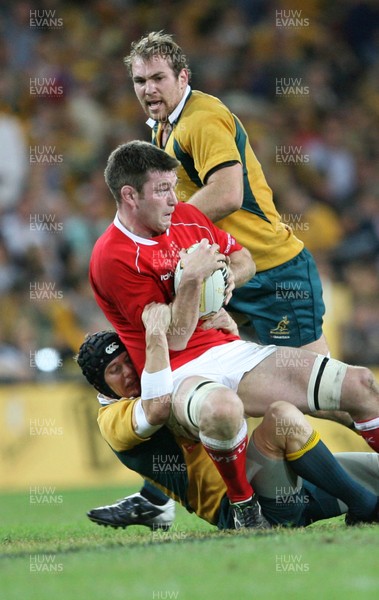 02.06.07 AUSTRALIA v WALES, 2nd Test ,Brisbane. Wales Michael Owen is tackled by Stephen larkham 
