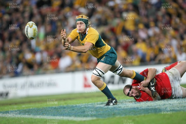 02.06.07 AUSTRALIA v WALES, 2nd Test ,Brisbane. Wales Ceri Morgan tackles Stephen Hoiles  