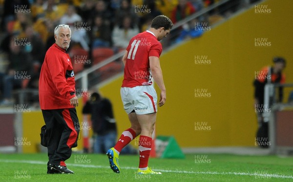 090612 - Australia v Wales - Castrol EDGE Series -George North of Wales leaves the field with Wales team doctor Professor John Williams