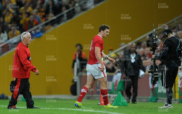 090612 - Australia v Wales - Castrol EDGE Series -George North of Wales leaves the field with Wales team doctor Professor John Williams