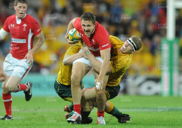 090612 - Australia v Wales - Castrol EDGE Series -Ashley Beck of Wales is tackled by Pat McCabe and David Pocock of Australia