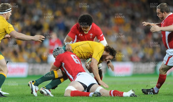 090612 - Australia v Wales - Castrol EDGE Series -Rob Simmons of Australia is tackled by Dan Lydiate of Wales