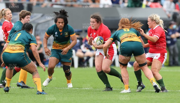 221022 - Australia v Wales, Women’s Rugby World Cup, Pool A - Cerys Hale of Wales takes on Liz Patu of Australia and Bridie O'Gorman of Australia